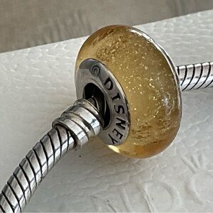 Pandora Disney Belle's Signature Colour Murano Charm glows in dark